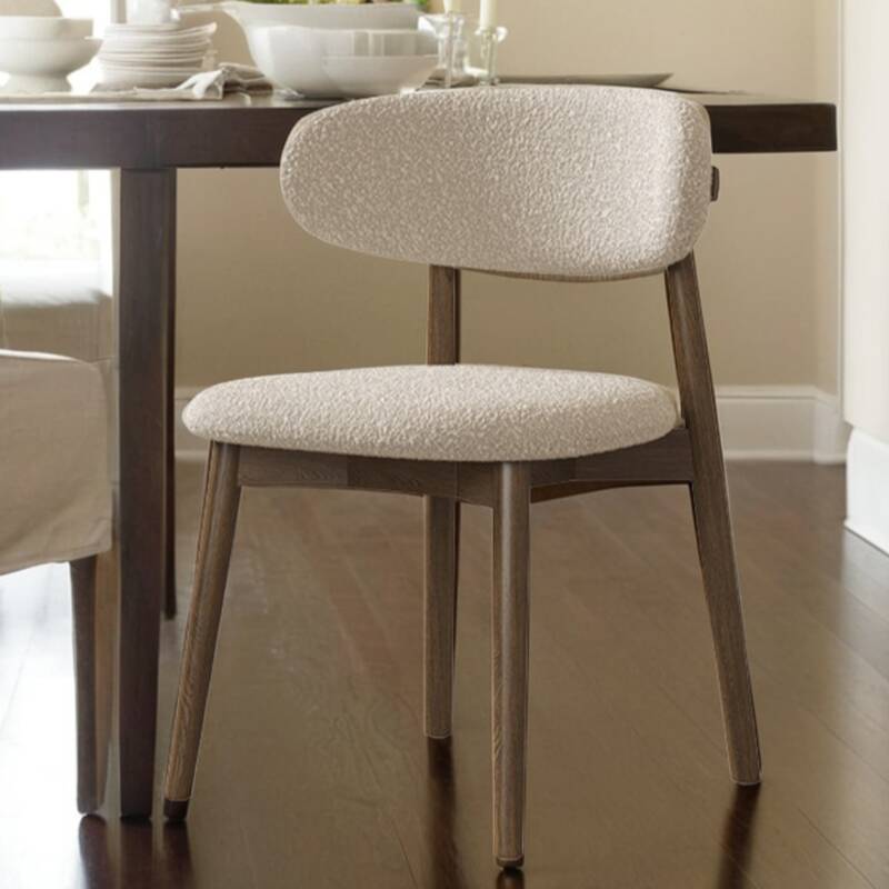 Minimalist Side Chair with Exposed Back, Padded Upholstery, and Lumber Legs